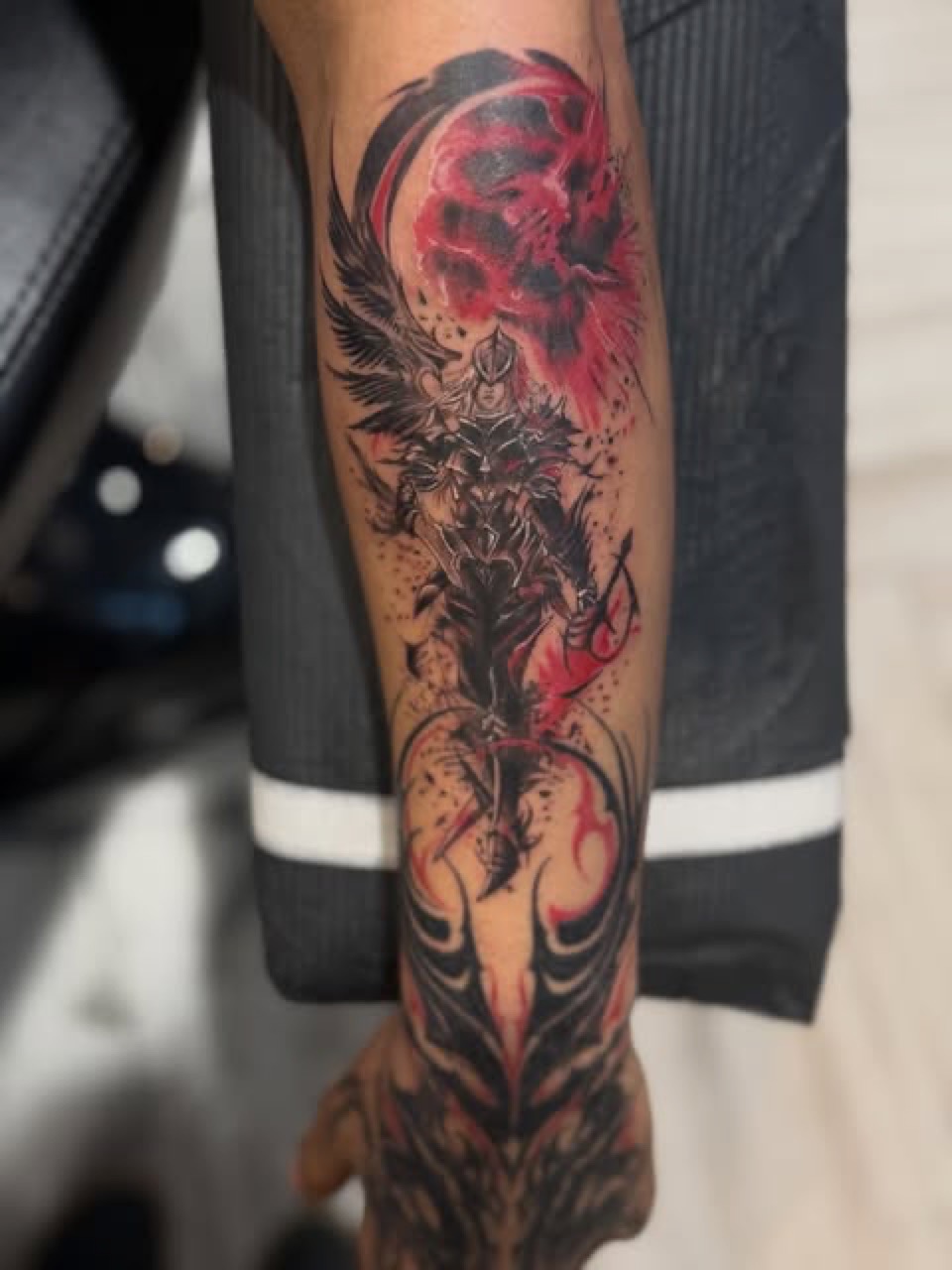Black and red fantasy custom tattoo by Lux at Yes Electric Tattoo Toronto